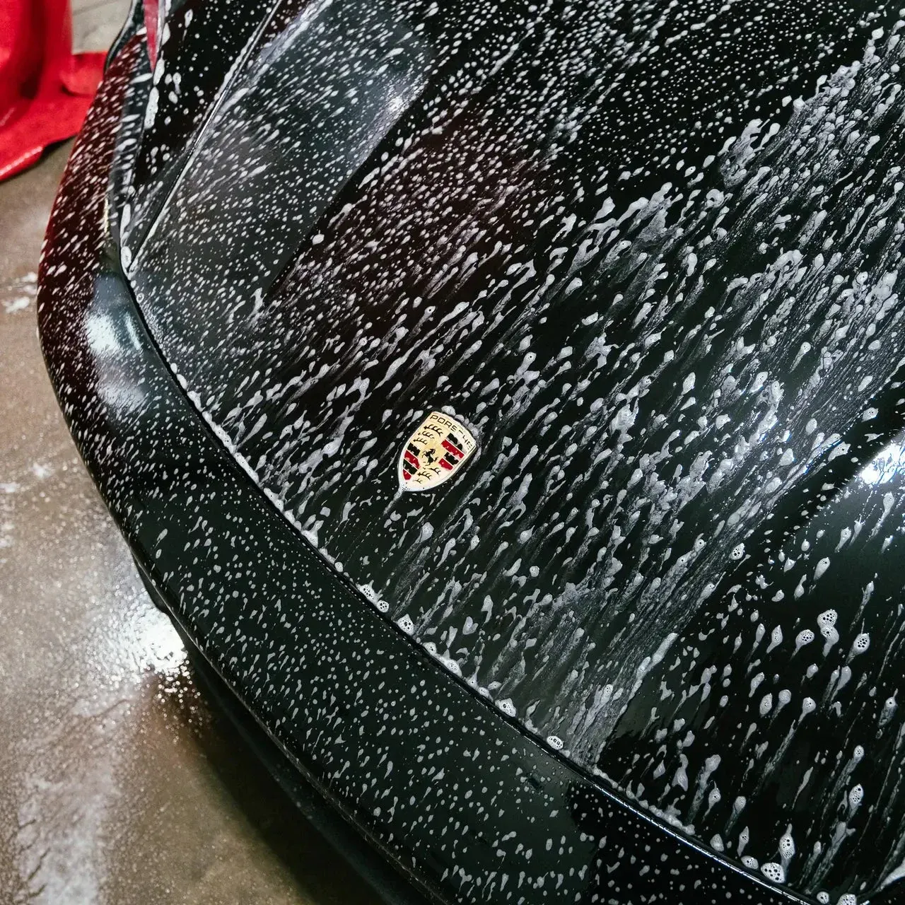 Stance Bros Calgary car detailing shop interior luxury vehicle.